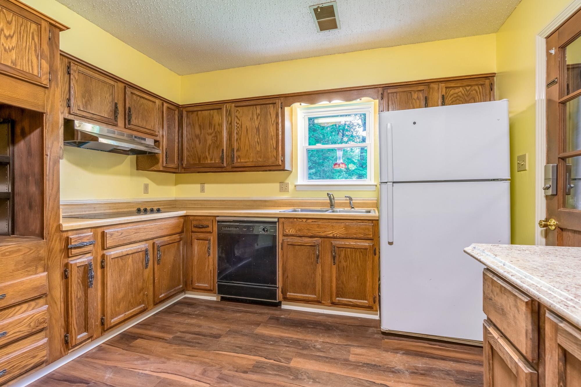 10860 Macedonia Road Brighton, TN 38011 - Photo 5 of 24 a kitchen with stainless steel appliances granite countertop a refrigerator sink and cabinets