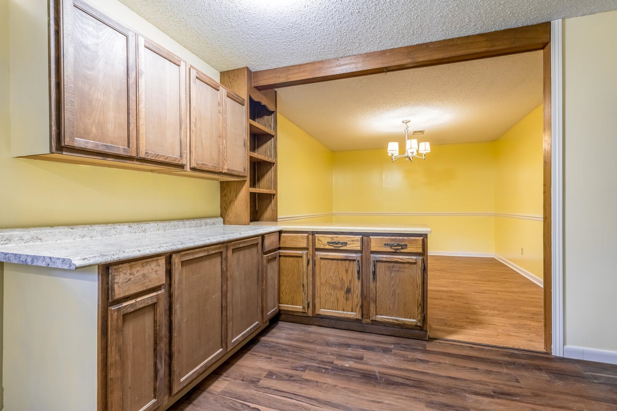 10860 Macedonia Road Brighton, TN 38011 - Photo 6 of 24 a kitchen with stainless steel appliances granite countertop a sink and cabinets