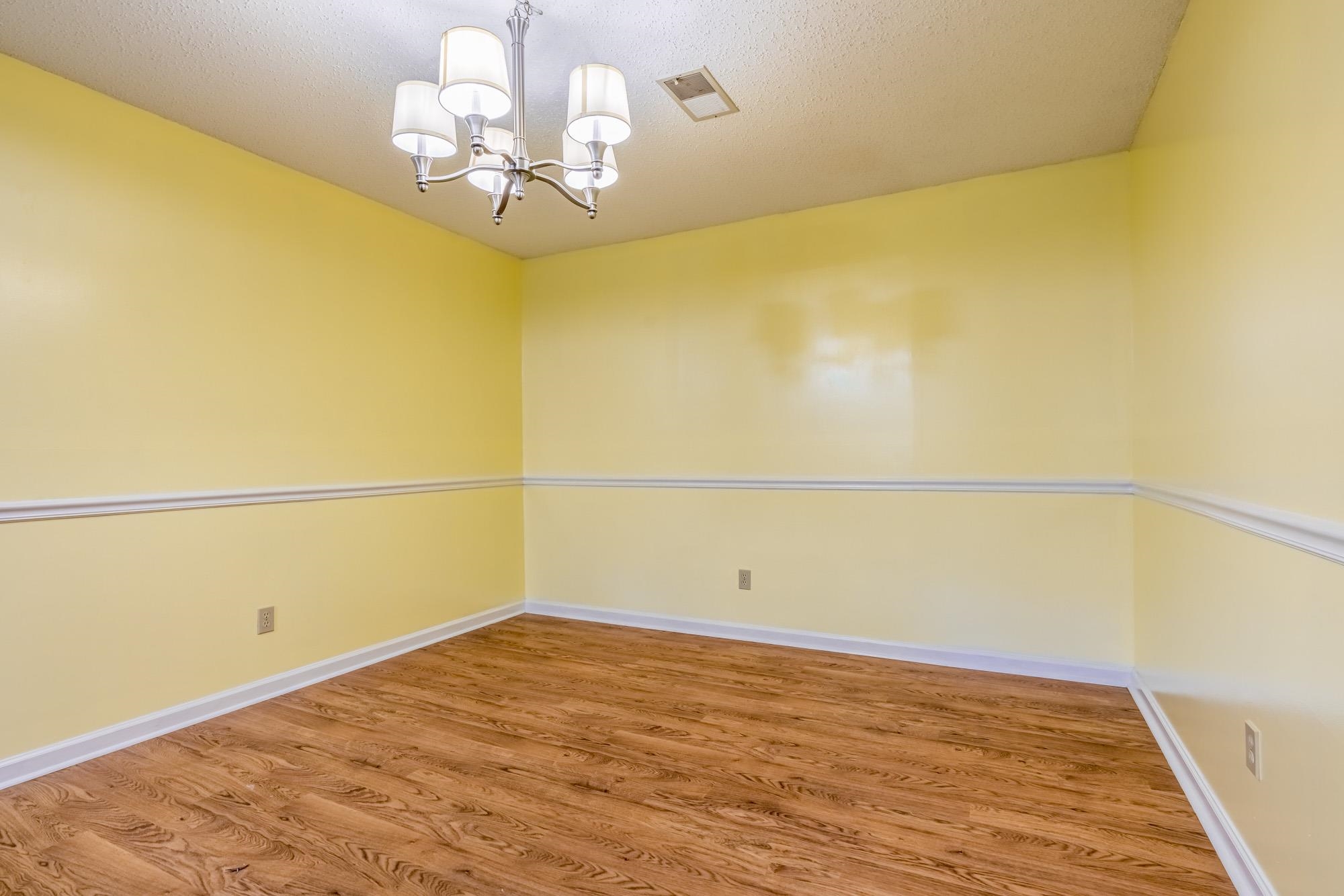 10860 Macedonia Road Brighton, TN 38011 - Photo 7 of 24 a view of a room with wooden floor and ceiling fan