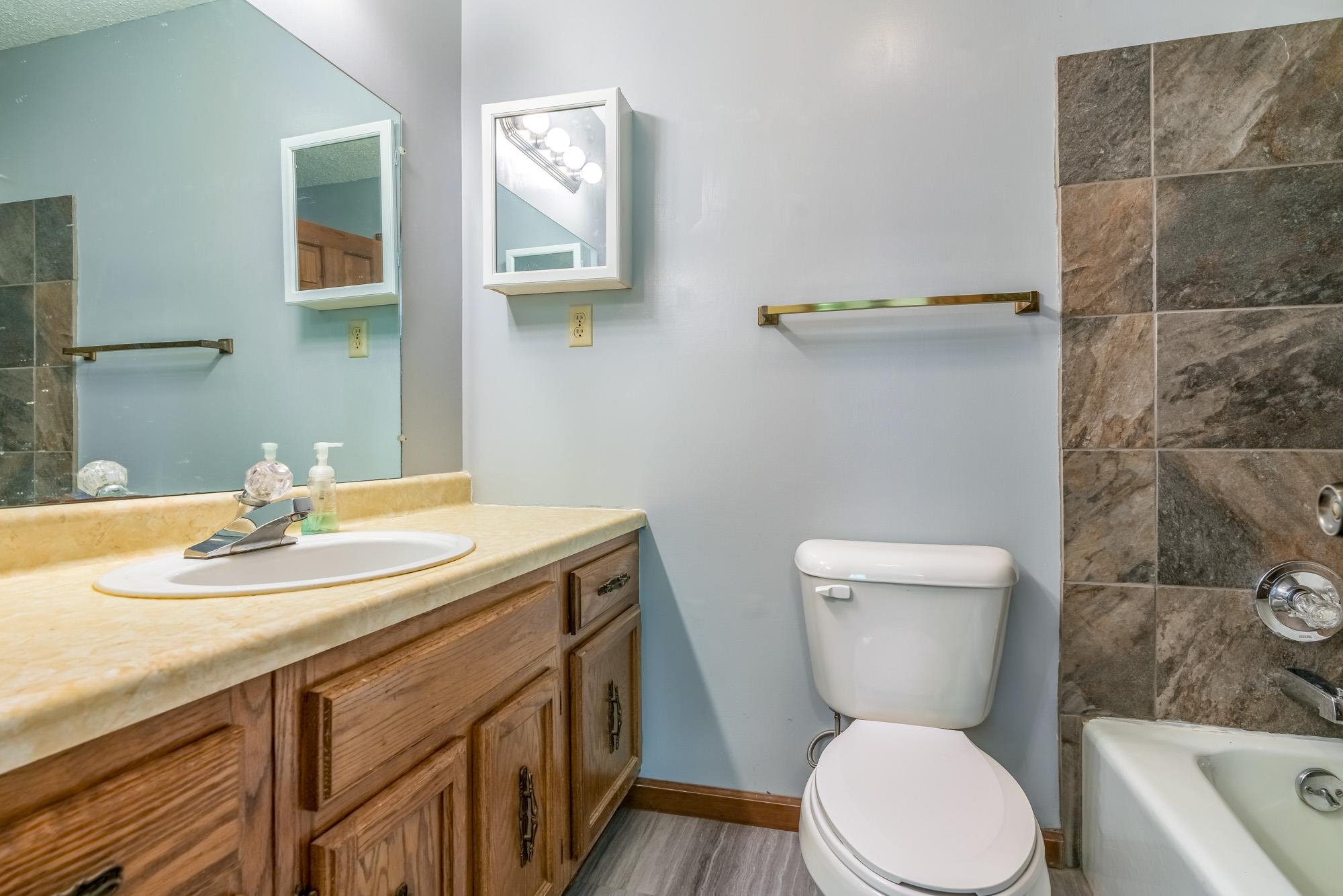 10860 Macedonia Road Brighton, TN 38011 - Photo 9 of 24 a bathroom with a sink a toilet and a mirror