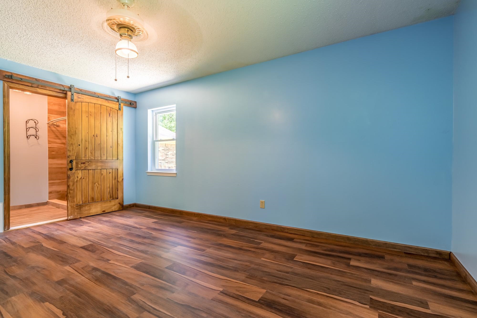 10860 Macedonia Road Brighton, TN 38011 - Photo 10 of 24 wooden floor in an empty room with a window