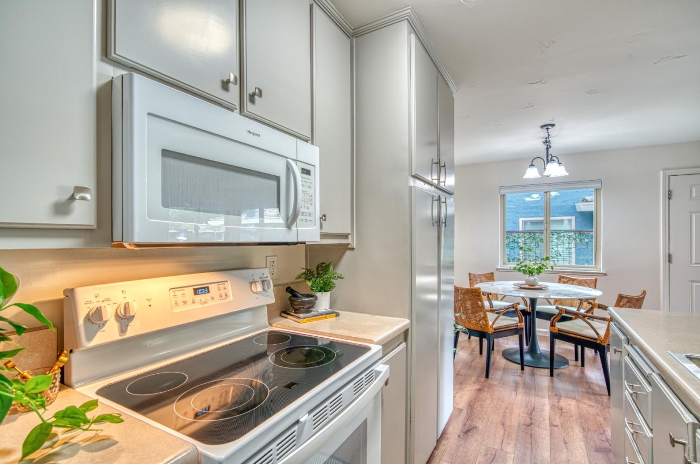 1380 Ruby Court, Unit 2 Capitola, CA 95010 - Photo 12 of 38 a kitchen with a stove a sink and a microwave