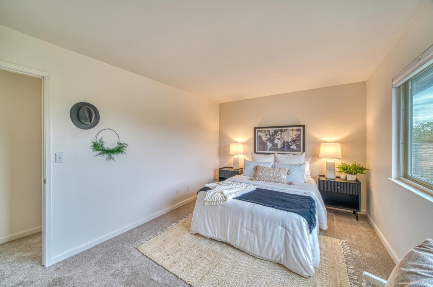 1380 Ruby Court, Unit 2 Capitola, CA 95010 - Photo 21 of 38 a bedroom with a bed and a window