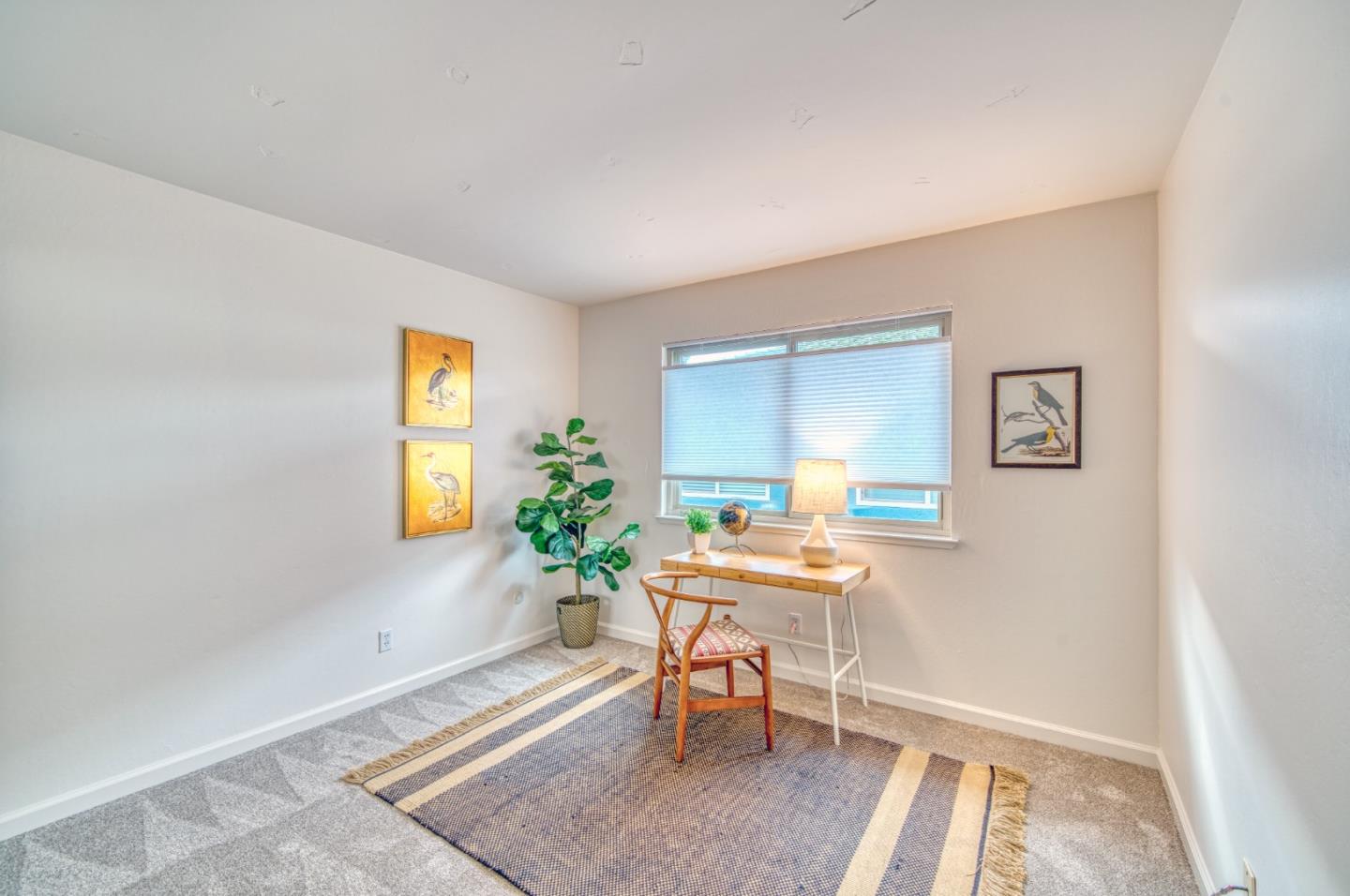 1380 Ruby Court, Unit 2 Capitola, CA 95010 - Photo 24 of 38 a room with furniture and a window