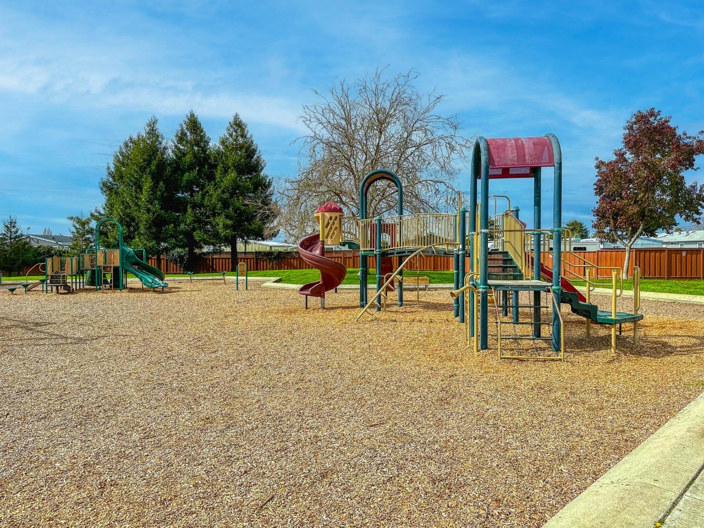 1380 Ruby Court, Unit 2 Capitola, CA 95010 - Photo 37 of 38 a view of park with swings and slides