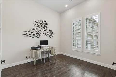a workspace with furniture and a window