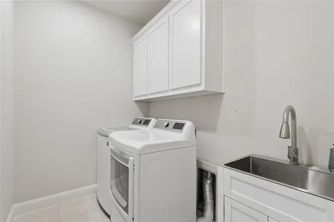 a view of storage and utility room with washer and dryer