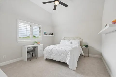 a bed room with a bed and a window