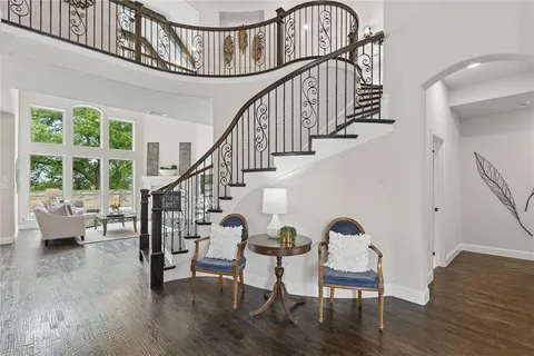 a view of entryway livingroom and hall with wooden floor