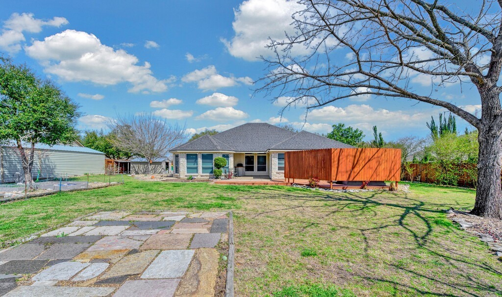 621 South Ruidoso Downs Drive Robinson, TX 76706 - Photo 35 of 41 a view of a house with a yard