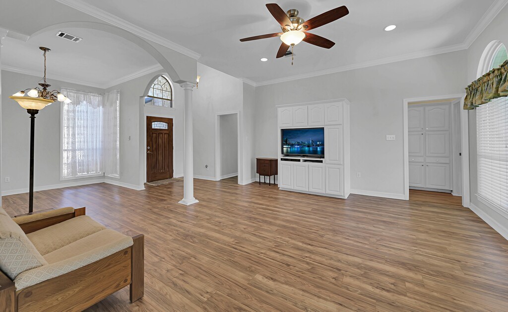 621 South Ruidoso Downs Drive Robinson, TX 76706 - Photo 6 of 41 a view of an empty room with window and wooden floor