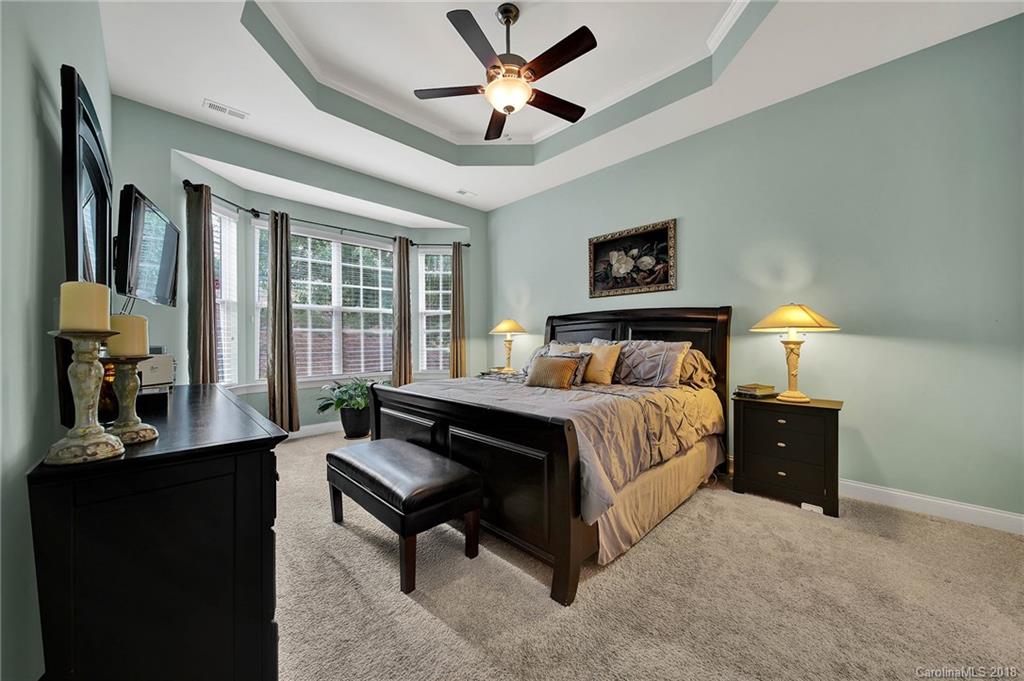 1336 Secret Path Drive Fort Mill, SC 29708 - Photo 13 of 27 a bedroom with a bed and wooden floor