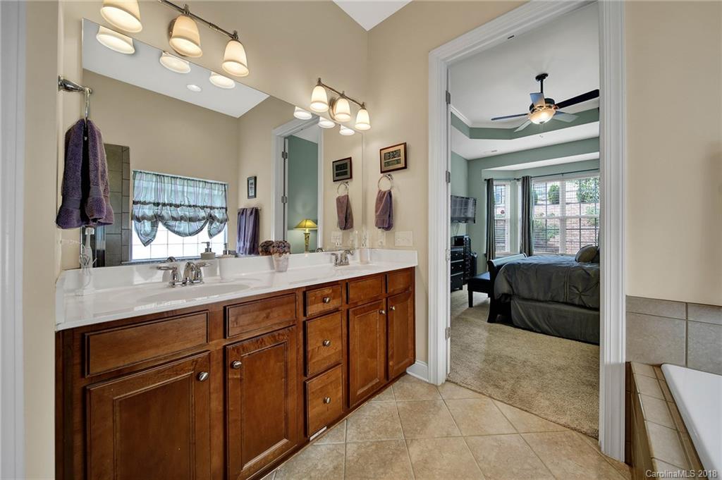 1336 Secret Path Drive Fort Mill, SC 29708 - Photo 15 of 27 a en suite bathroom with double vanity and a mirror