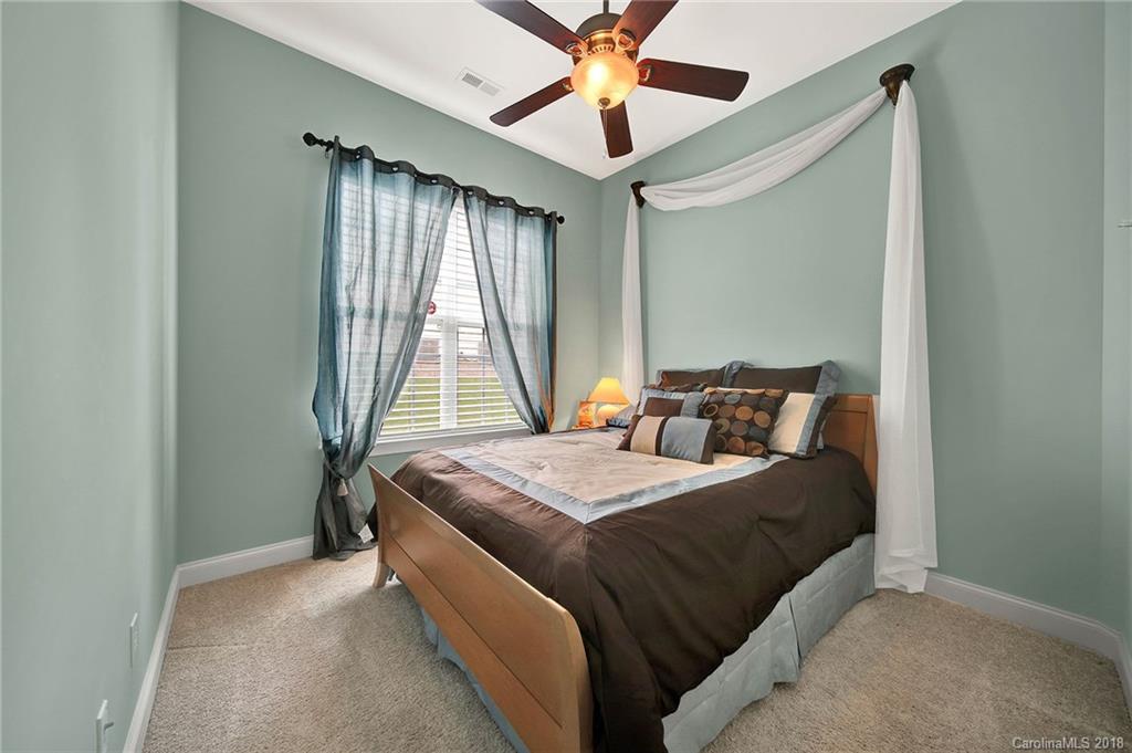 1336 Secret Path Drive Fort Mill, SC 29708 - Photo 17 of 27 a bedroom with a bed and window