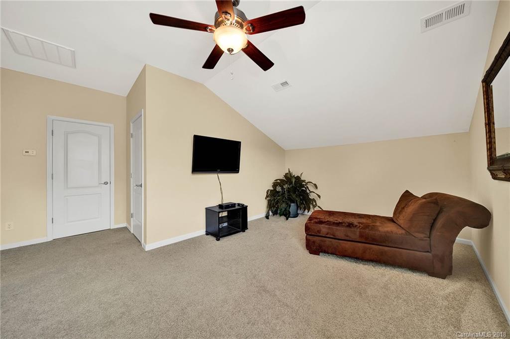 1336 Secret Path Drive Fort Mill, SC 29708 - Photo 19 of 27 a living room with furniture and a flat screen tv