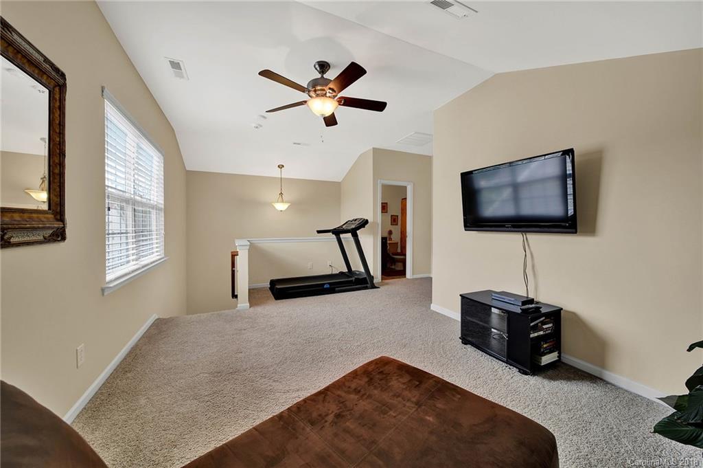 1336 Secret Path Drive Fort Mill, SC 29708 - Photo 20 of 27 a living room with furniture and a flat screen tv