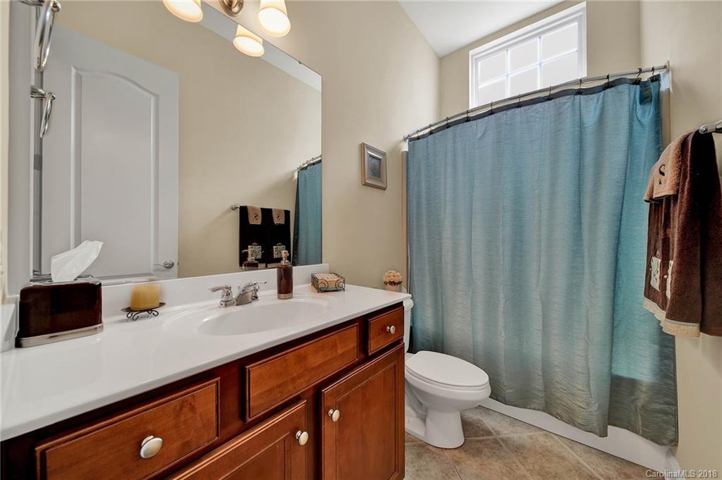 1336 Secret Path Drive Fort Mill, SC 29708 - Photo 24 of 27 a bathroom with a sink a toilet and shower