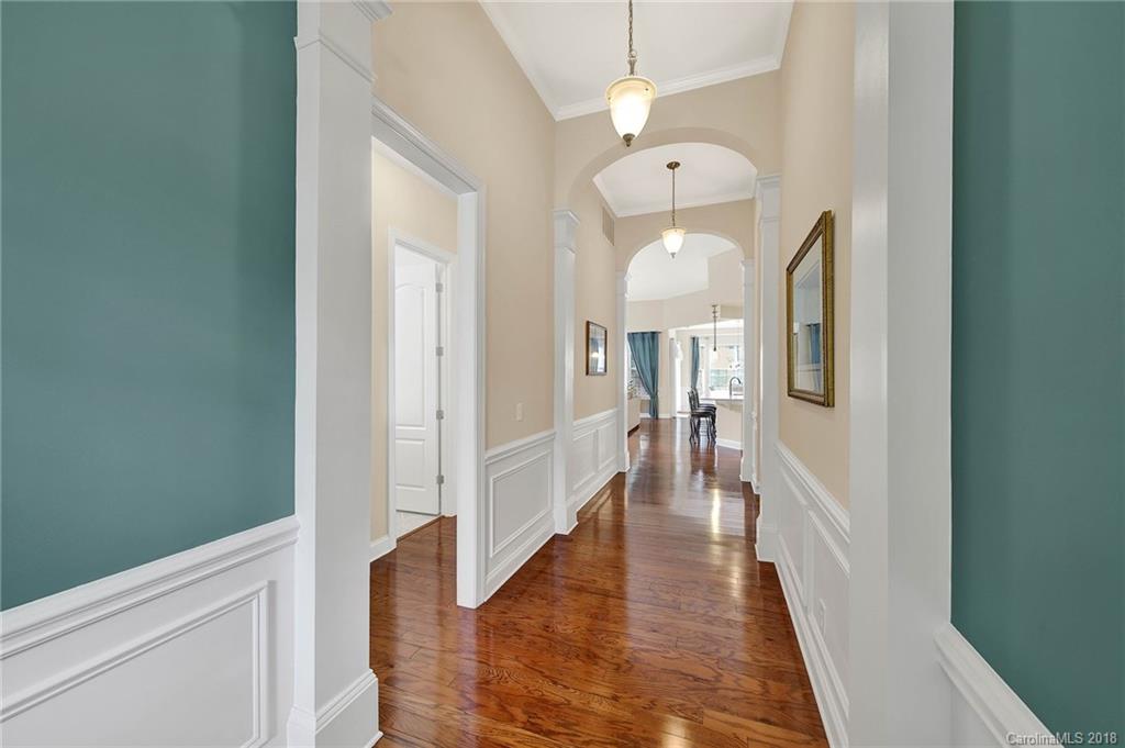 1336 Secret Path Drive Fort Mill, SC 29708 - Photo 4 of 27 a view of a hallway with wooden floor and staircase