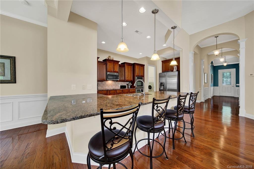 1336 Secret Path Drive Fort Mill, SC 29708 - Photo 5 of 27 a view of a dining room with furniture and wooden floor
