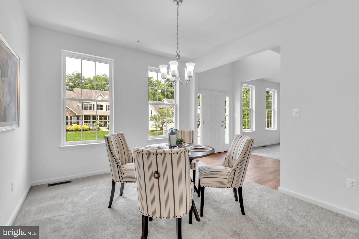 6606 Lost Fox Lane Hanover, MD 21076 - Photo 6 of 19 a view of a dining room with furniture window and outside view