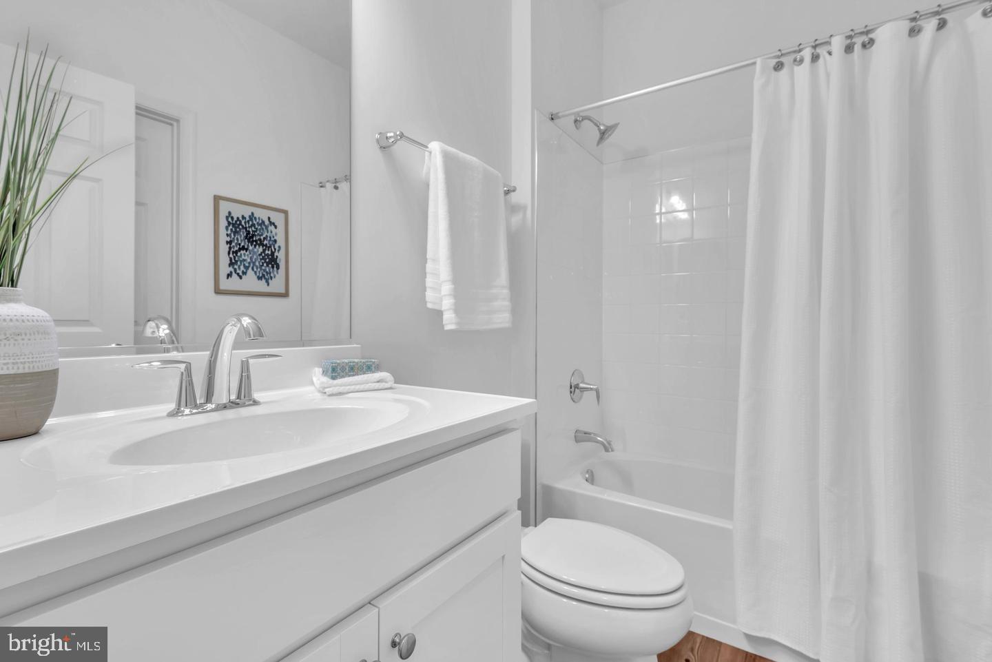 6606 Lost Fox Lane Hanover, MD 21076 - Photo 10 of 19 a bathroom with a sink a toilet and shower