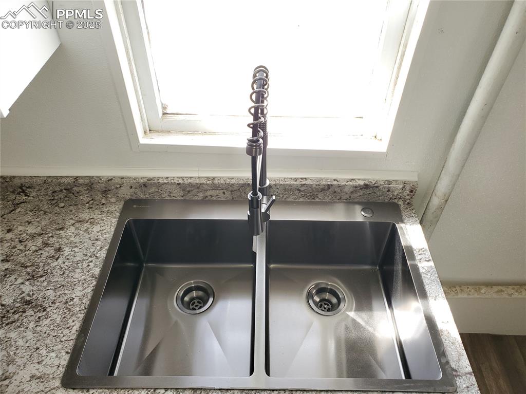 102 South 12th Street Lamar, CO 81052 - Photo 14 of 28 a bathroom with a sink and mirror