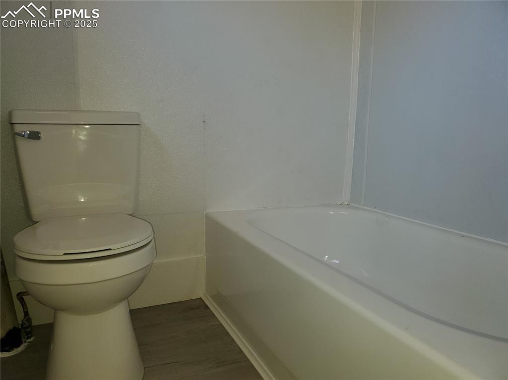 102 South 12th Street Lamar, CO 81052 - Photo 22 of 28 a bathroom with a sink and a toilet