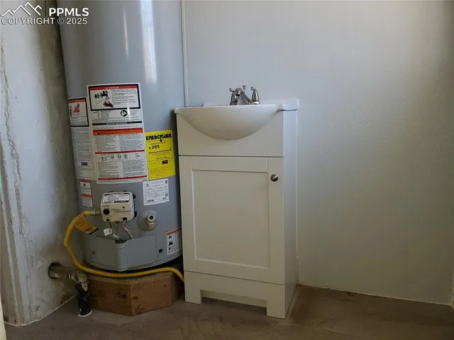 a bathroom with a sink and mirror