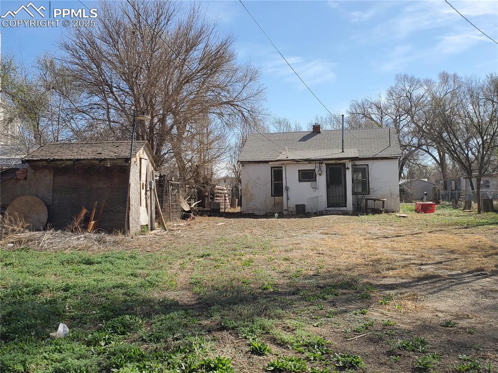 102 South 12th Street Lamar, CO 81052 - Photo 25 of 28 a front view of a house with a yard