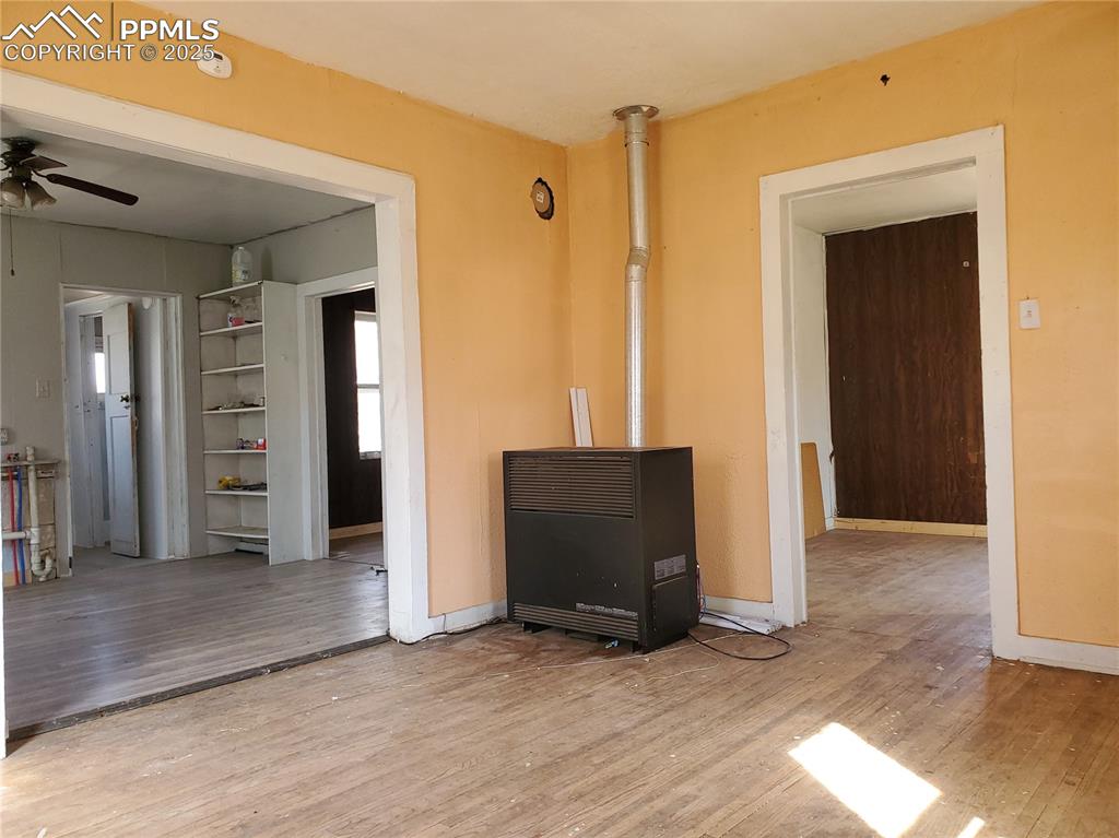 102 South 12th Street Lamar, CO 81052 - Photo 7 of 28 wooden floor and windows in a room
