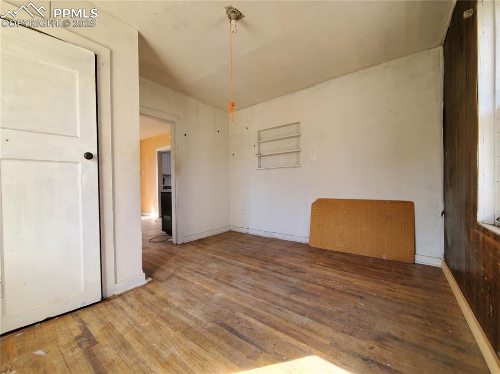 102 South 12th Street Lamar, CO 81052 - Photo 10 of 28 a view of an empty room and wooden floor