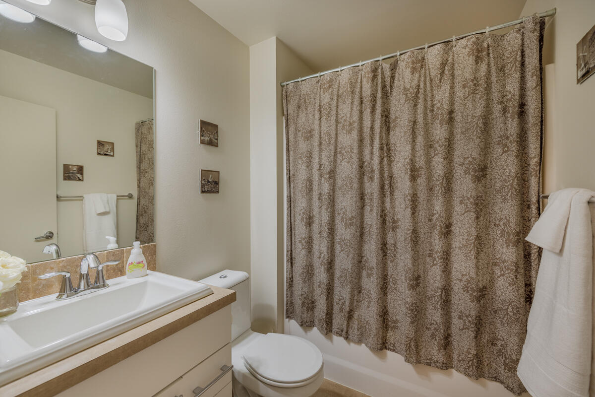 61274 Blakely Road Bend, OR 97702 - Photo 17 of 32 a bathroom with a granite countertop sink toilet and shower