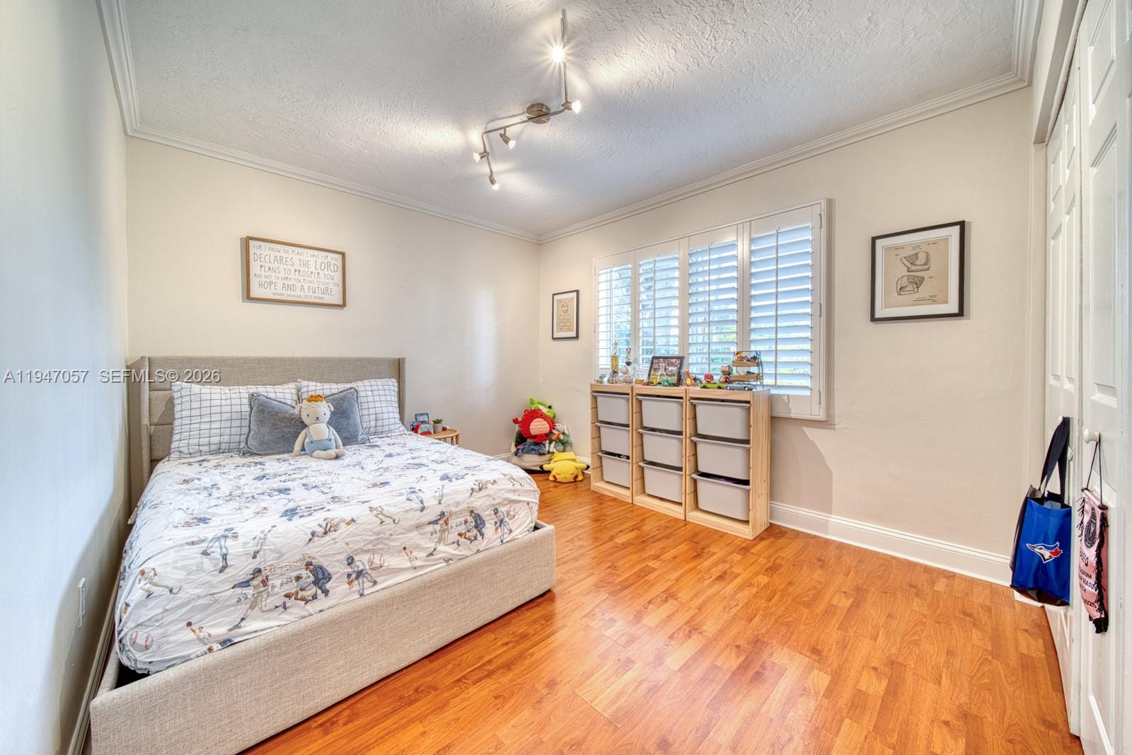 12620 Southwest 114th Avenue Miami, FL 33176 - Photo 17 of 37 a bedroom with bed and wooden floor