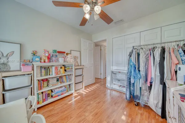 a room with furniture and a book shelf