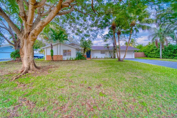 front view of a house with a yard