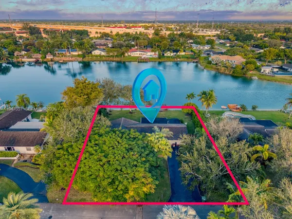 view of a lake with a table and chairs