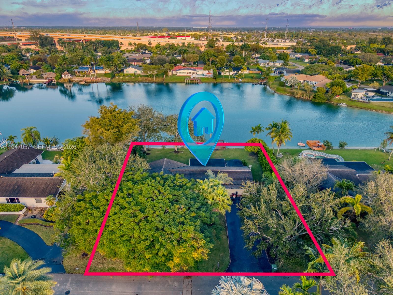 12620 Southwest 114th Avenue Miami, FL 33176 - Photo 35 of 37 view of a lake with a table and chairs