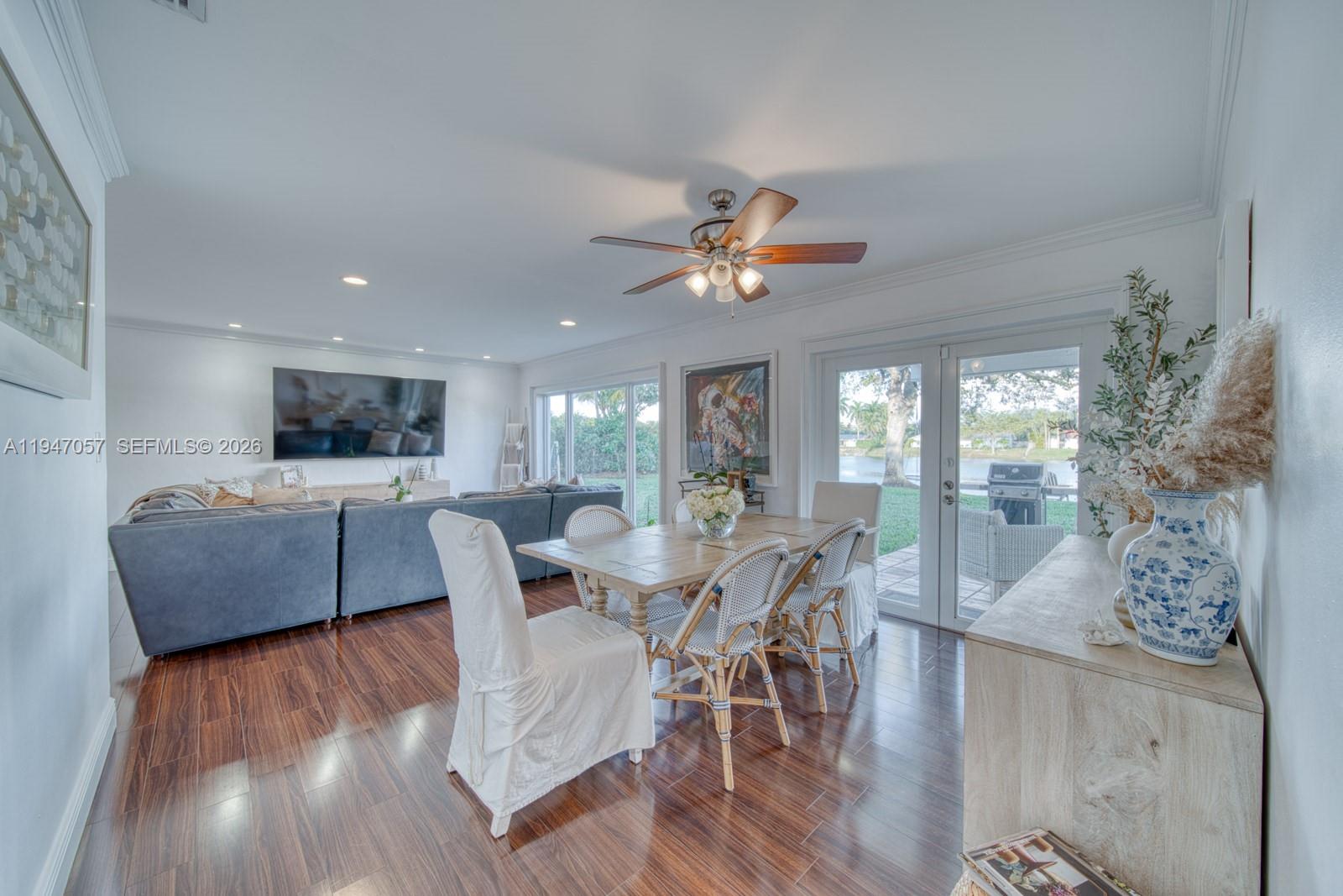 12620 Southwest 114th Avenue Miami, FL 33176 - Photo 7 of 37 a view of a dining room with furniture and wooden floor
