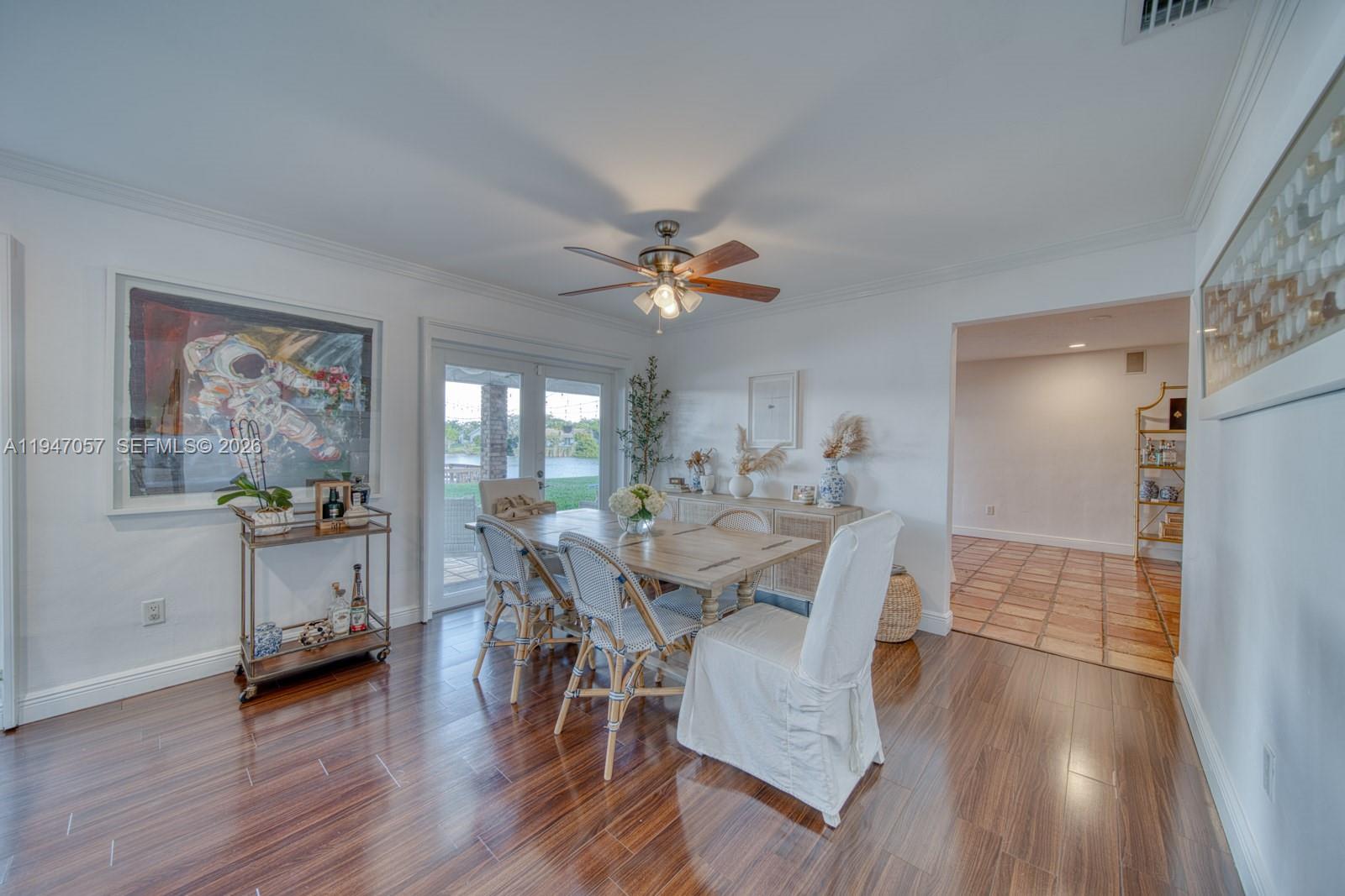 12620 Southwest 114th Avenue Miami, FL 33176 - Photo 8 of 37 a view of a dining room with furniture and wooden floor