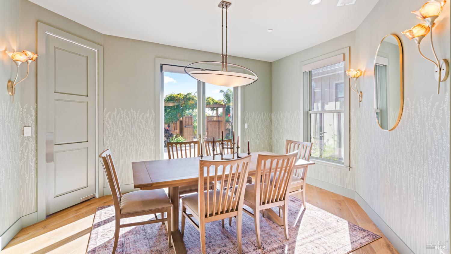 3971 Rincon Ridge Drive Santa Rosa, CA 95404 - Photo 13 of 61 The formal dining room features double doors that open to the front courtyard, creating an ideal setting for indoor-outdoor entertaining.