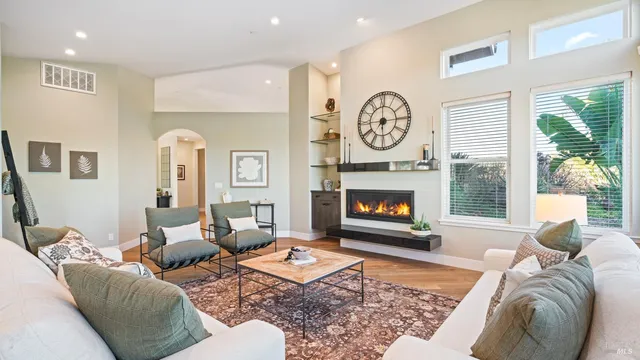 a kitchen with a table chairs refrigerator and microwave