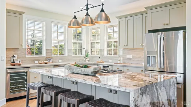 a kitchen with granite countertop a sink and a window