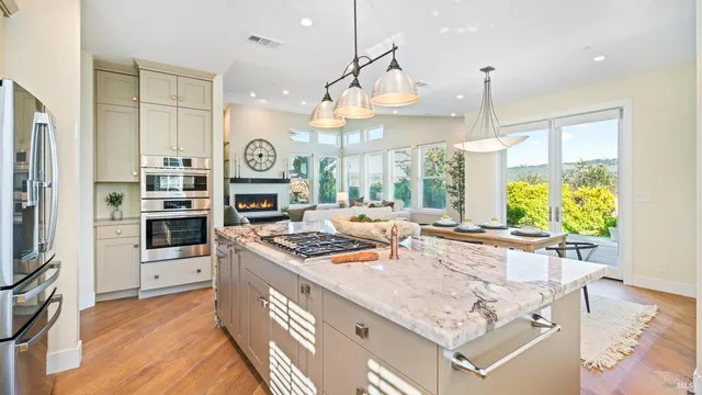 a kitchen with a sink and a refrigerator