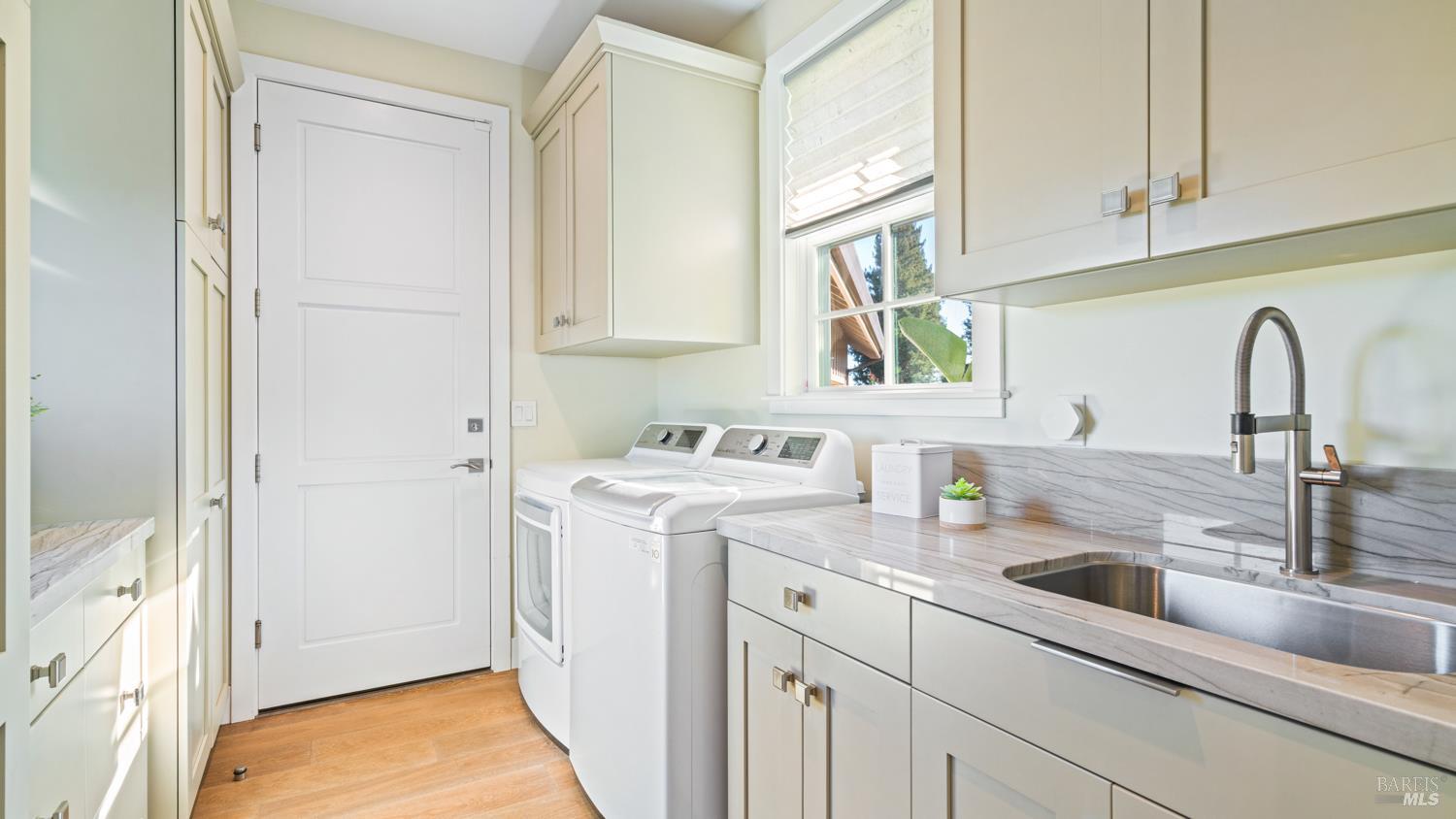 3971 Rincon Ridge Drive Santa Rosa, CA 95404 - Photo 27 of 61 Laundry room with ample storage.