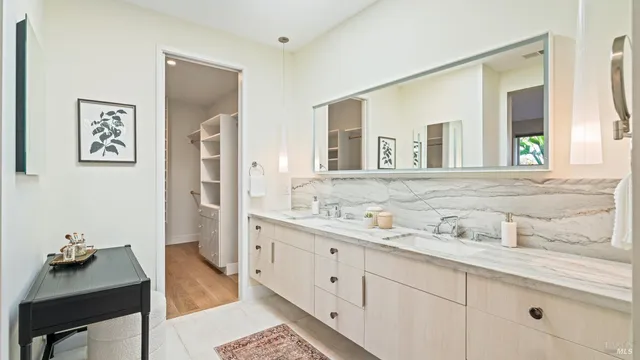 a bedroom with two beds and a window