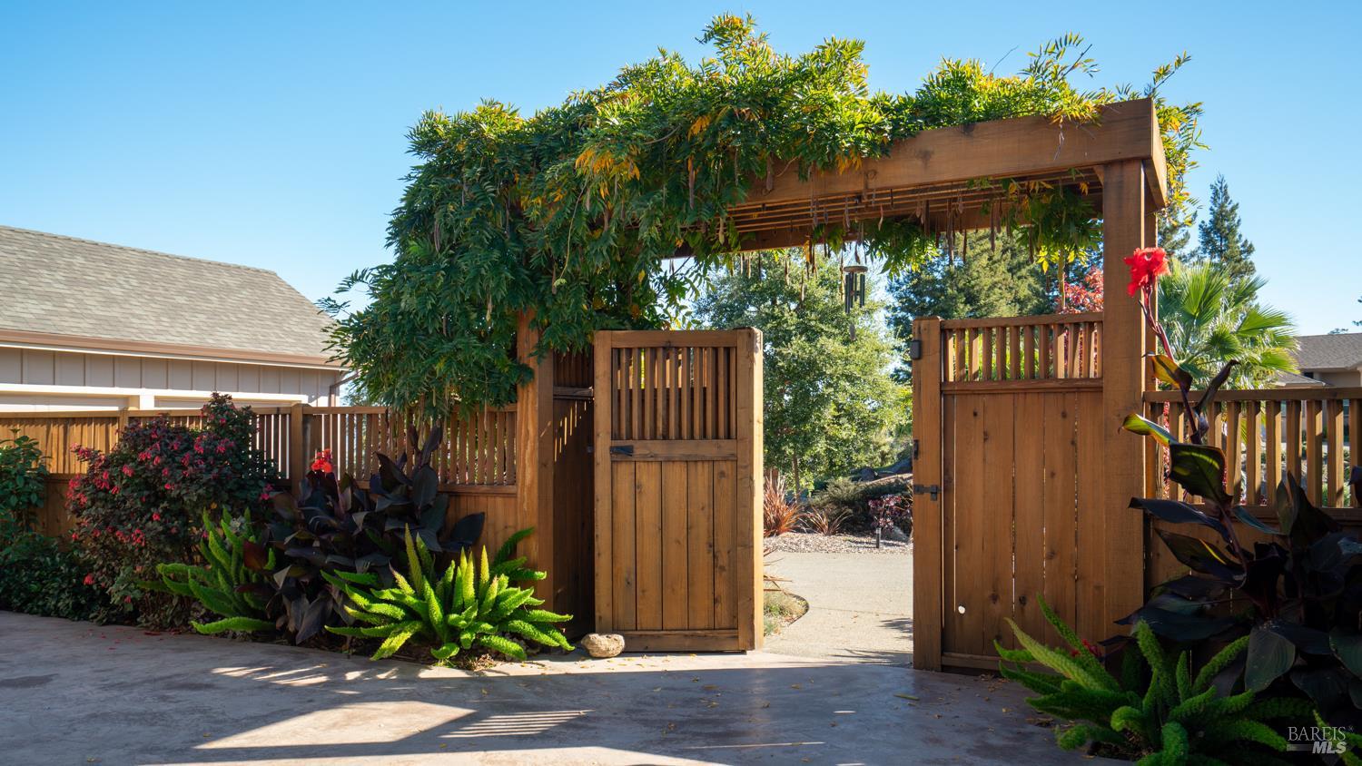 3971 Rincon Ridge Drive Santa Rosa, CA 95404 - Photo 4 of 61 Step through the stylish courtyard entry gate into a beautifully landscaped retreat.