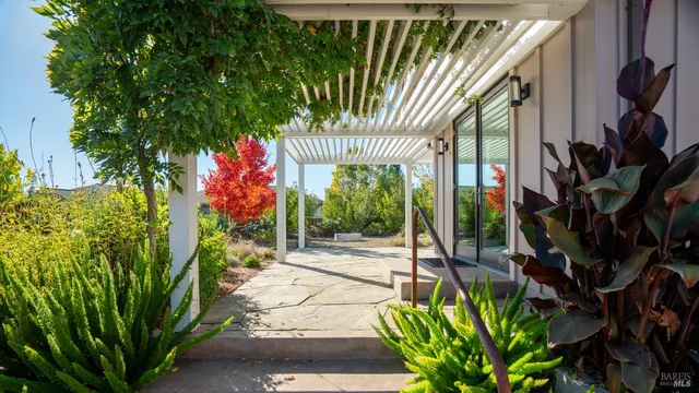 a front view of a house with garden