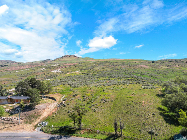 15610 North Beaver Dam Road, Unit 2 Collinston, UT 84306 - Photo 7 of 10 Expansive green hillside property with distant mountain terrain