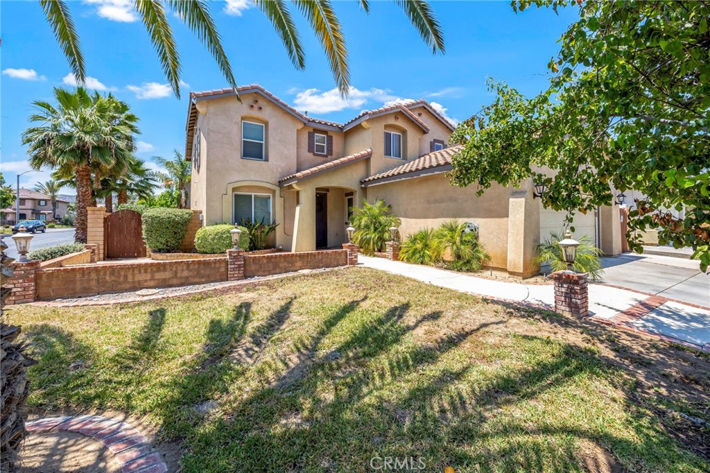 151 Ropango Way Hemet, CA 92545 - Photo 2 of 28 a front view of a house with a yard