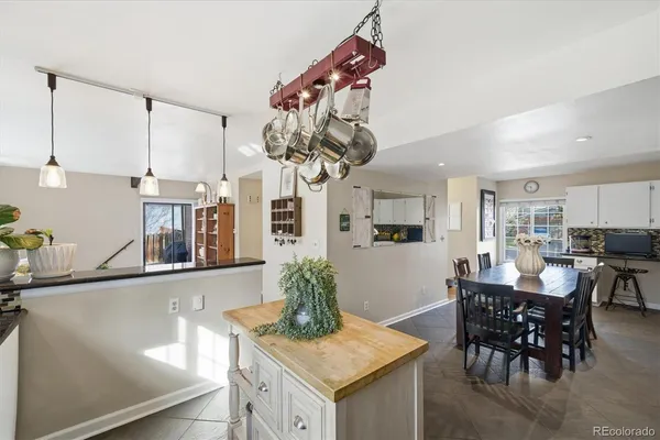 a kitchen with stainless steel appliances granite countertop sink stove top oven and cabinets
